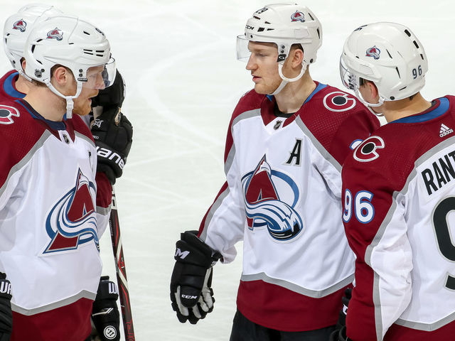 WINNIPEG, MB - JANUARY 8: Gabriel Landeskog #92, Nathan MacKinnon #29 and Mikko Rantanen #96 of the Colorado Avalanche discuss strategy during a second period stoppage in play against the Winnipeg Jets at the Bell MTS Place on January 8, 2019 in Winnipeg, Manitoba, Canada. The Jets defeated the Avs 7-4.