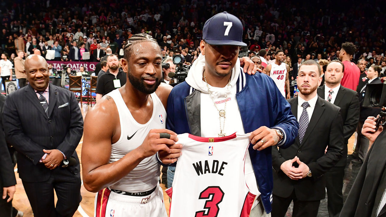 NEW YORK, NEW YORK - APRIL 10: Dwyane Wade #3 of the Miami Heat gives his jersey to former NBA player Carmelo Anthony after the game against the Brooklyn Nets at Barclays Center on April 10, 2019 in the Brooklyn borough of New York City. This was Wade's last NBA game before retirement.