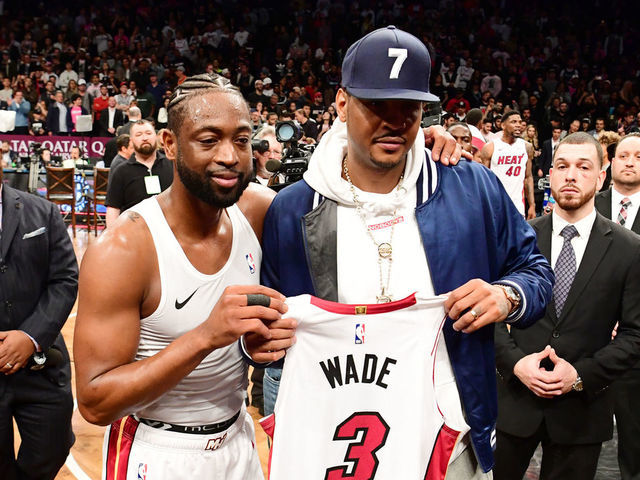 NEW YORK, NEW YORK - APRIL 10: Dwyane Wade #3 of the Miami Heat gives his jersey to former NBA player Carmelo Anthony after the game against the Brooklyn Nets at Barclays Center on April 10, 2019 in the Brooklyn borough of New York City. This was Wade's last NBA game before retirement.