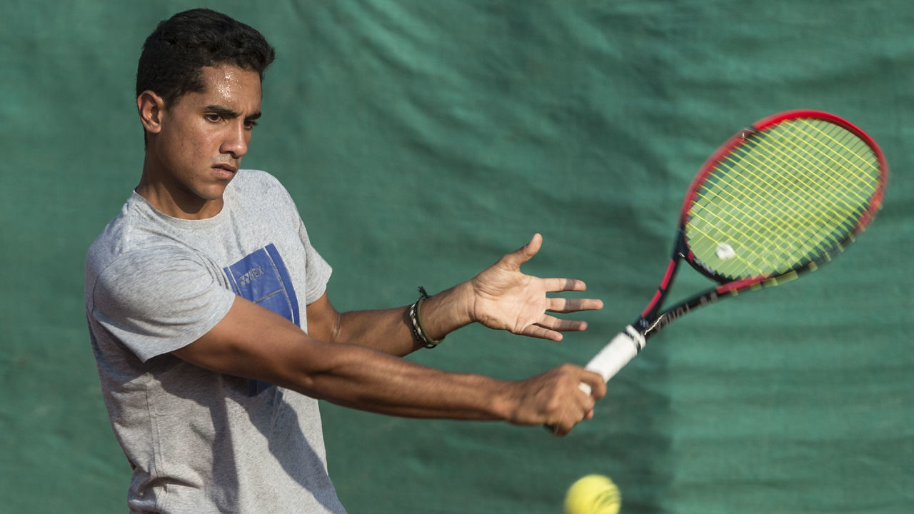 Youssef Hossam, a 19-year-old Egyptian tennis player currently holding an ATP 334 ranking, trains at a court in the capital Cairo's western suburb of Sixth of October, on September 19, 2017. Hossam, the only tennis player in Africa and the Arab world on the world junior rankings, is struggling to find a sponsor to support his promising career as he and his coaches fear his talent may fail to reach its potential without proper financing. / AFP PHOTO / KHALED DESOUKI
