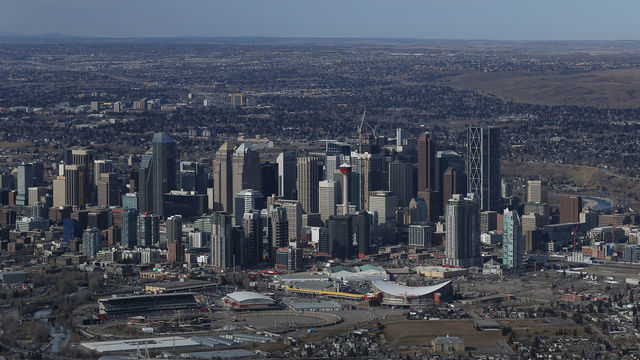 CALGARY, CANADA - FEBRUARY 26: An aerial view of the Scotiabank Saddledome home of the NHLâs Calgary Flames and the grounds of the Calgary Stampede in the foreground and the city skyline as seen from above on February 26, 2016 in Calgary, Alberta.