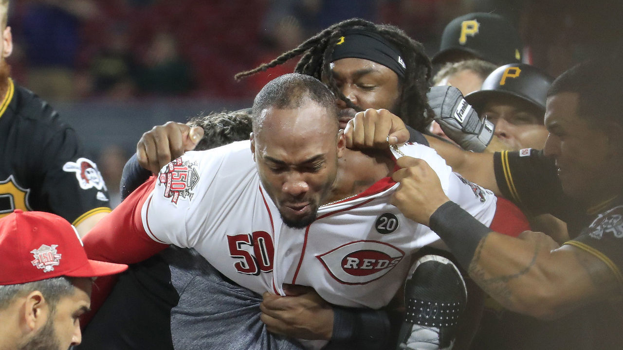 CINCINNATI, OHIO - JULY 30: Amir Garrett #50 (middle white shirt with out hat) of the Cincinnati Reds engages members of the Pittsburgh Pirates during a bench clearing altercation in the 9th inning of the game at Great American Ball Park on July 30, 2019 in Cincinnati, Ohio.