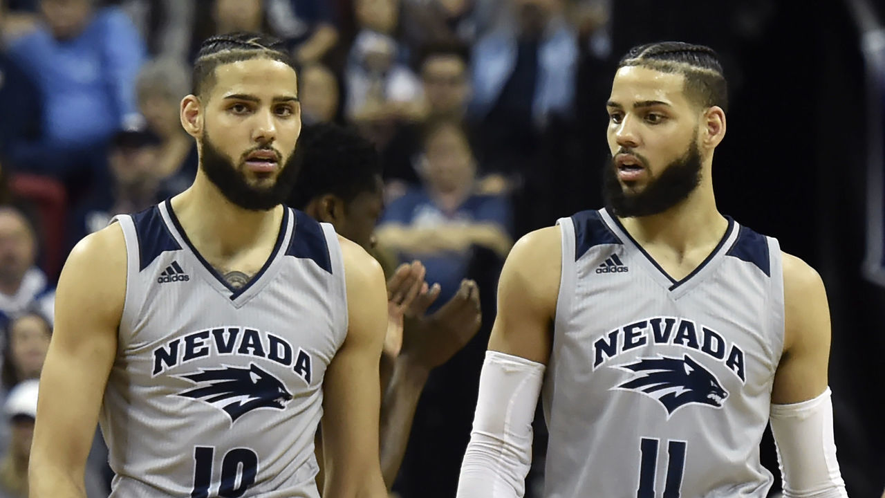 LAS VEGAS, NEVADA - MARCH 15: Caleb Martin #10 and Cody Martin #11 of the Nevada Wolf Pack walk up court during a semifinal game of the Mountain West Conference basketball tournament against the San Diego State Aztecs at the Thomas & Mack Center on March 15, 2019 in Las Vegas, Nevada. San Diego State Aztecs won 65-56.