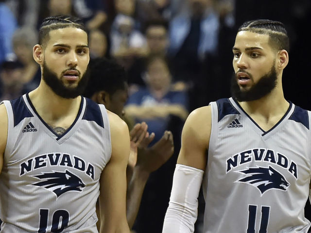 LAS VEGAS, NEVADA - MARCH 15: Caleb Martin #10 and Cody Martin #11 of the Nevada Wolf Pack walk up court during a semifinal game of the Mountain West Conference basketball tournament against the San Diego State Aztecs at the Thomas & Mack Center on March 15, 2019 in Las Vegas, Nevada. San Diego State Aztecs won 65-56.