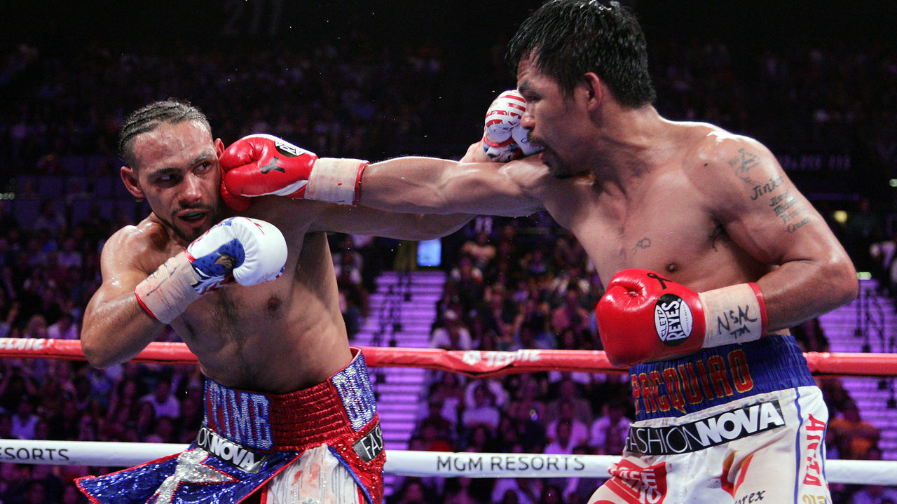 Filipino boxer Manny Pacquiao (R) connects with a right to the face of US boxer Keith Thurman during their WBA super world welterweight title fight at the MGM Grand Garden Arena on July 20, 2019 in Las Vegas, Nevada. - Pacquiao won a 12 round split decision.