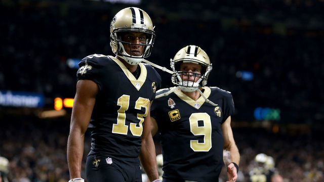 NEW ORLEANS, LOUISIANA - JANUARY 13: Michael Thomas #13 and Drew Brees #9 of the New Orleans Saints celebrate their third quarter touchdown against the Philadelphia Eagles in the NFC Divisional Playoff Game at Mercedes Benz Superdome on January 13, 2019 in New Orleans, Louisiana.