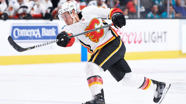 SAN JOSE, CA - SEPTEMBER 27: Calgary Flames defenseman Michael Stone (26) takes a shot during the San Jose Sharks game versus the Calgary Flames on September 27, 2018, at SAP Center at San Jose in San Jose, CA.