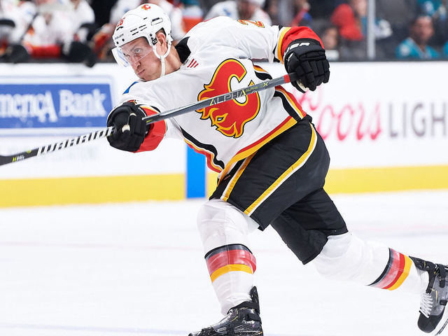 SAN JOSE, CA - SEPTEMBER 27: Calgary Flames defenseman Michael Stone (26) takes a shot during the San Jose Sharks game versus the Calgary Flames on September 27, 2018, at SAP Center at San Jose in San Jose, CA.