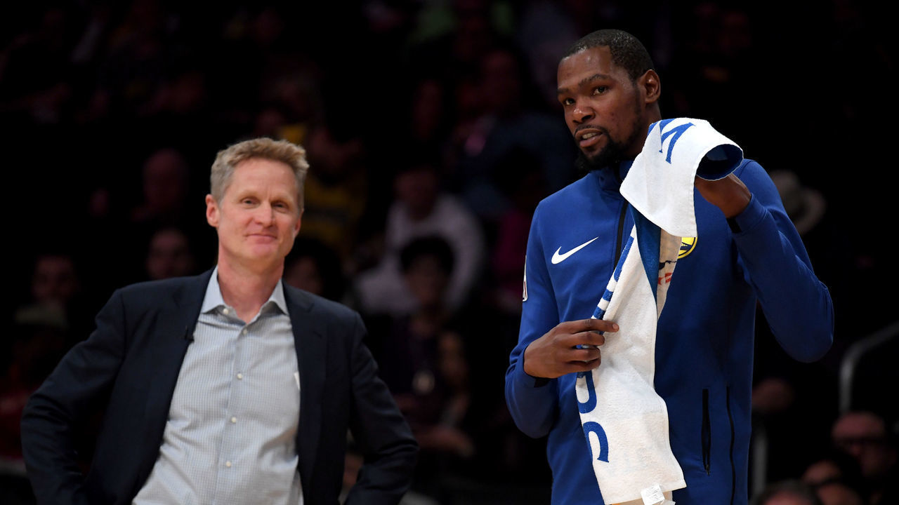 LOS ANGELES, CALIFORNIA - JANUARY 21: Kevin Durant #35 and Steve Kerr of the Golden State Warriors smile courtside during a 130-111 win over the Los Angeles Lakers at Staples Center on January 21, 2019 in Los Angeles, California.