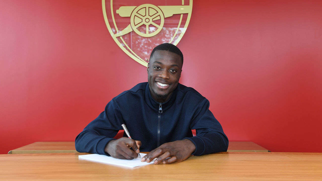 ST ALBANS, ENGLAND - JULY 31: Nicolas Pepe signs his contract for Arsenal at London Colney on July 31, 2019 in St Albans, England.