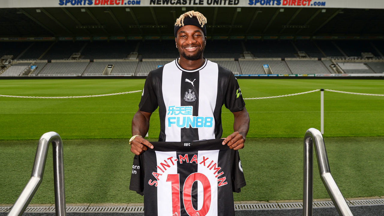 NEWCASTLE UPON TYNE, ENGLAND - AUGUST 02: (EXCLUSIVE COVERAGE) New Newcastle United signing Allan Saint-Maximin poses for photographs pitchside wearing a Home Shirt during a photocall at St.James' Park on August 02, 2019 in Newcastle upon Tyne, England.