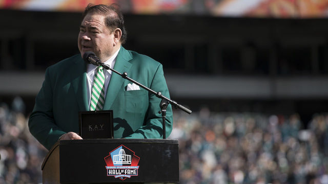 PHILADELPHIA, PA - OCTOBER 21: President of the Pro Football Hall of Fame, David Baker, presents Brian Dawkins (not pictured) with his Hall of Fame ring during halftime of the game between the Carolina Panthers and Philadelphia Eagles at Lincoln Financial Field on October 21, 2018 in Philadelphia, Pennsylvania.