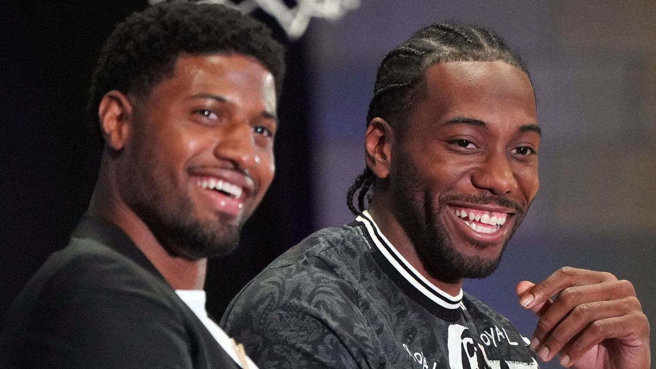 LOS ANGELES, CA - JULY 24: New Clippers players Paul George, left, and Kawhi Leonard laugh during a press conference at the Green Meadows Recreation Center in Los Angeles on Wednesday, July 24, 2019. George and Leonard were introduced to the media and fans as the newest members of the Clippers.