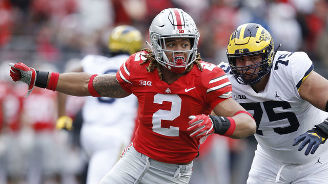 COLUMBUS, OH - NOVEMBER 24: Chase Young #2 of the Ohio State Buckeyes rushes against Jon Runyan #75 of the Michigan Wolverines during the game at Ohio Stadium on November 24, 2018 in Columbus, Ohio. Ohio State won 62-39.