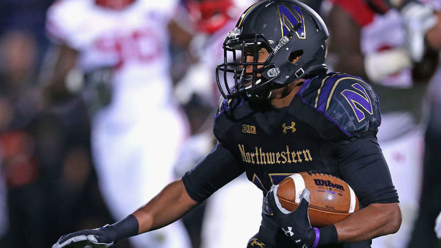 EVANSTON, IL - OCTOBER 18: Solomon Vault #15 of the Northwestern Wildcats runs against the Nebraska Cornhuskers at Ryan Field on October 18, 2014 in Evanston, Illinois.