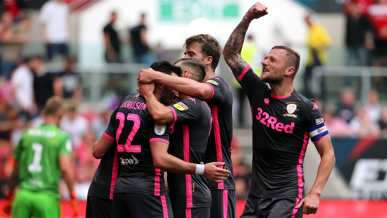 Leeds United's Jack Harrison (left) celebrates scoring his side's third goal of the game with Liam Cooper (right) and team-mates during the Sky Bet Championship match at Ashton Gate, Bristol.