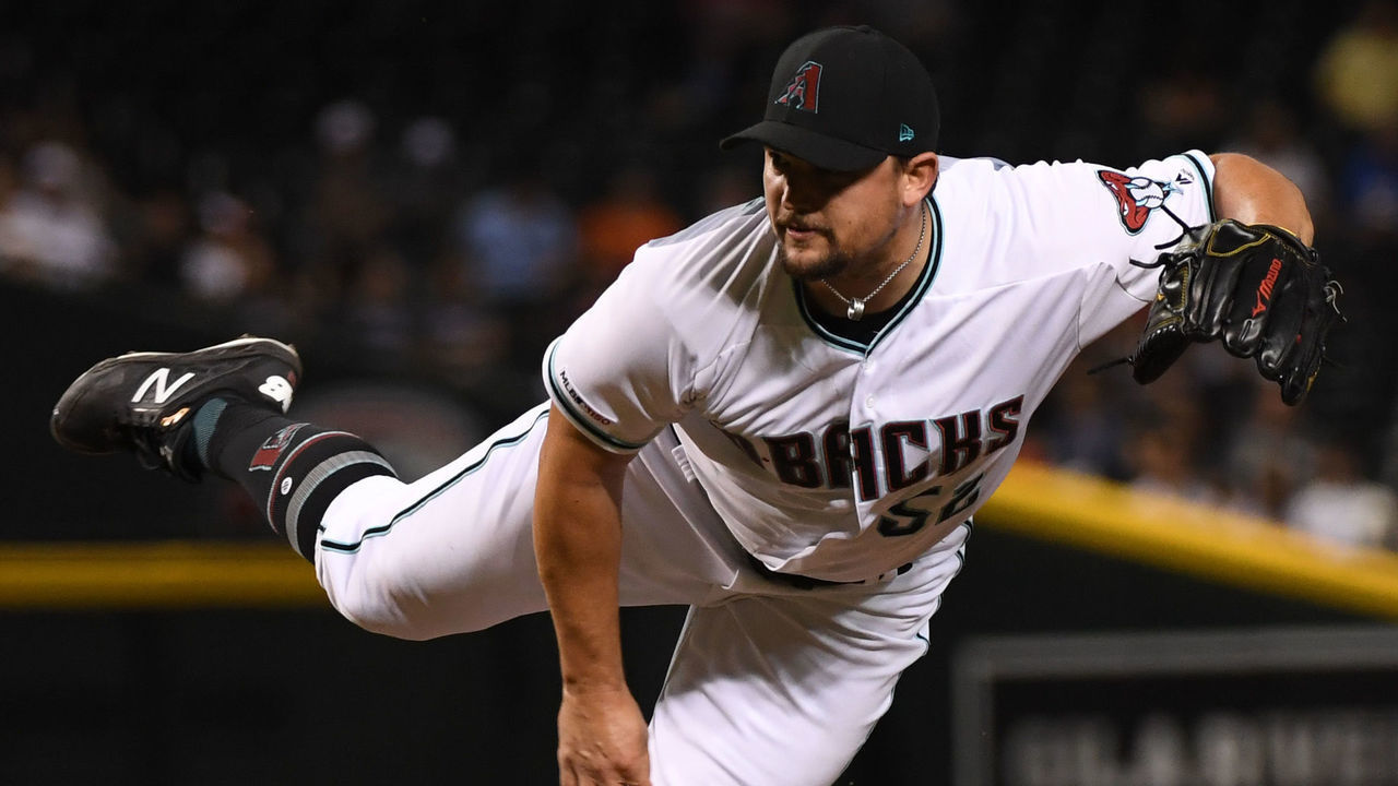 PHOENIX, ARIZONA - JULY 23: Zack Godley #52 of the Arizona Diamondbacks delivers a pitch against the Baltimore Orioles at Chase Field on July 23, 2019 in Phoenix, Arizona.
