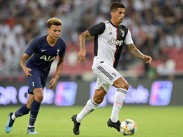 Manchester City's Joao Cancelo heads the ball during the Champions