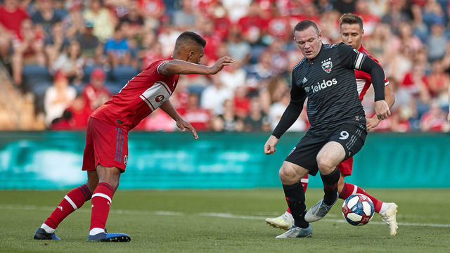 BRIDGEVIEW, IL - JULY 27: D.C. United forward Wayne Rooney (9) battles with Chicago Fire midfielder Przemyslaw Frankowski (11) and Chicago Fire defender Johan Kappelhof (4) in game action during a MLS match between D.C. United and Chicago Fire on July 27, 2019 at SeatGeek Stadium in Bridgeview, IL.