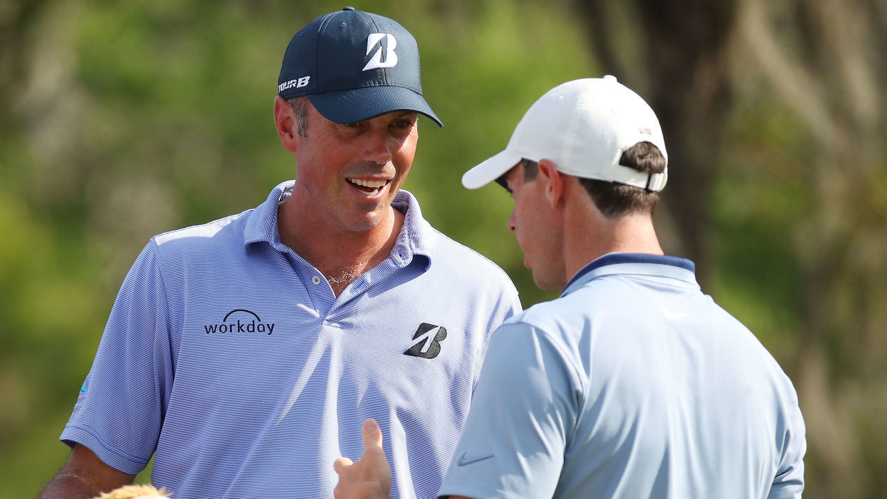 PONTE VEDRA BEACH, FLORIDA - MARCH 15: Matt Kuchar of the United States and Rory McIlroy of Northern Ireland talk during the second round of The PLAYERS Championship on The Stadium Course at TPC Sawgrass on March 15, 2019 in Ponte Vedra Beach, Florida.