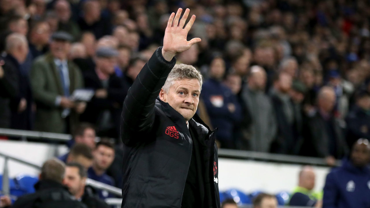 Manchester United Interim Manager Ole Gunnar Solskjaer waves to the fans during the Premier League match at the Cardiff City Stadium.