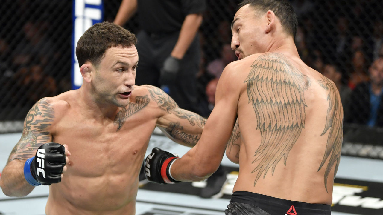 EDMONTON, ALBERTA - JULY 27: (L-R) Frankie Edgar punches Max Holloway in their UFC featherweight championship bout during the UFC 240 event at Rogers Place on July 27, 2019 in Edmonton, Alberta, Canada.