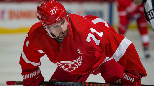 DETROIT, MI - MARCH 31: Dylan Larkin #71 of the Detroit Red Wings gets set for the face-off against the Boston Bruins during an NHL game at Little Caesars Arena on March 31, 2019 in Detroit, Michigan. Detroit defeated Boston 6-3.