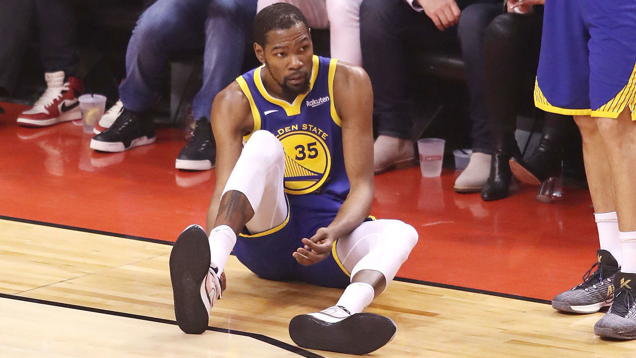 TORONTO, ONTARIO - JUNE 10: Kevin Durant #35 of the Golden State Warriors reacts after sustaining an injury during the second quarter against the Toronto Raptors during Game Five of the 2019 NBA Finals at Scotiabank Arena on June 10, 2019 in Toronto, Canada.