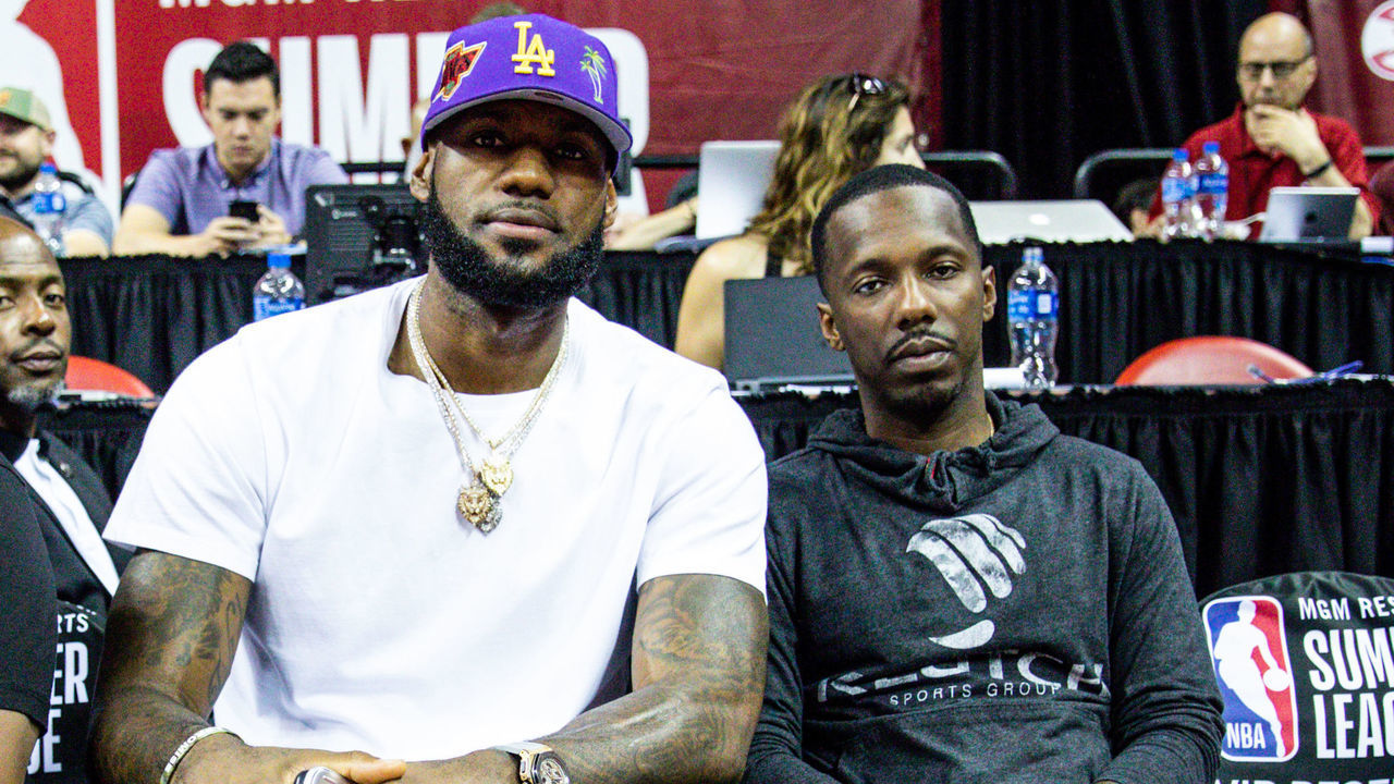 LAS VEGAS, NEVADA - JULY 05: (L-R) Ernie Ramos, LeBron James and Rich Paul sit court side at NBA Summer League on July 05, 2019 in Las Vegas, Nevada.