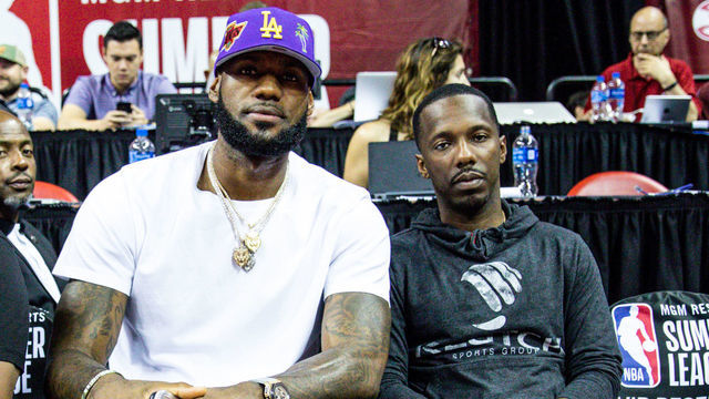 LAS VEGAS, NEVADA - JULY 05: (L-R) Ernie Ramos, LeBron James and Rich Paul sit court side at NBA Summer League on July 05, 2019 in Las Vegas, Nevada.