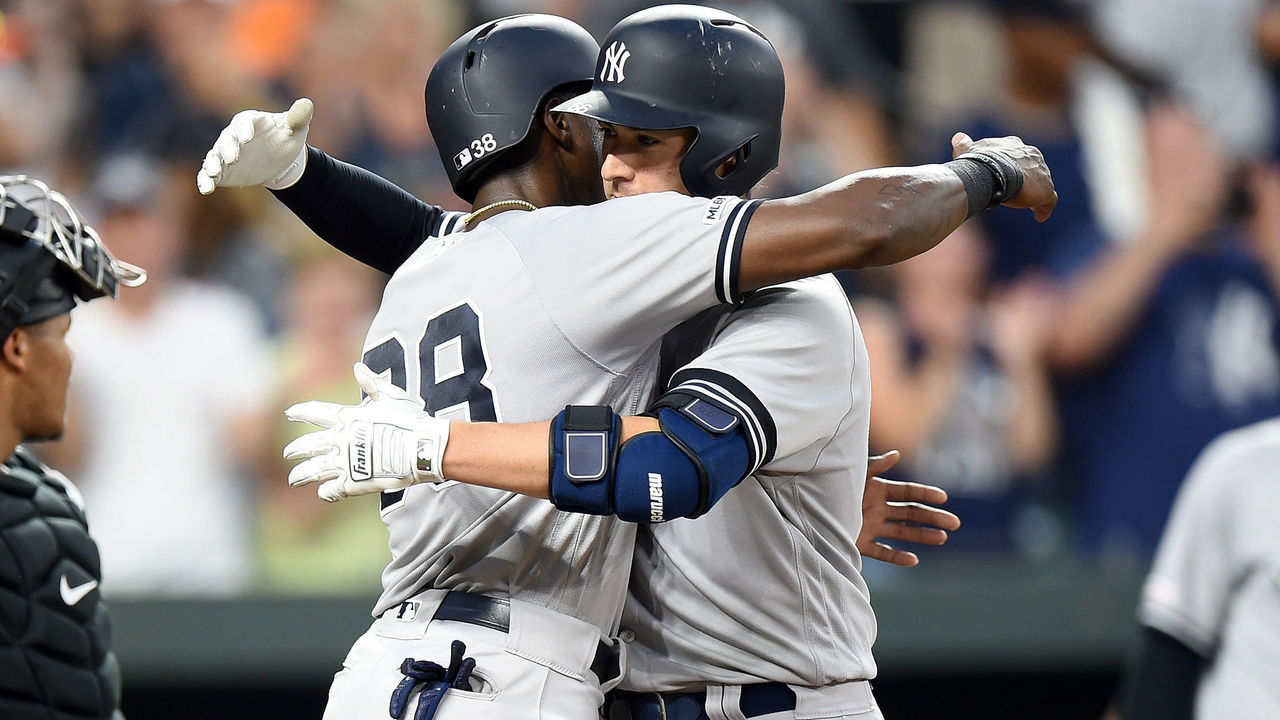 BALTIMORE, MD - AUGUST 07: Kyle Higashioka #66 of the New York Yankees celebrates with Cameron Maybin #38 after hitting a three-run home run in the fourth inning against the Baltimore Orioles at Oriole Park at Camden Yards on August 7, 2019 in Baltimore, Maryland.