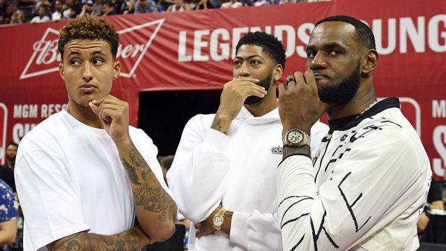 LAS VEGAS, NEVADA - JULY 06: (L-R) Kyle Kuzma, Anthony Davis and LeBron James of the Los Angeles Lakers talk before a game between the Lakers and the LA Clippers during the 2019 NBA Summer League at the Thomas & Mack Center on July 6, 2019 in Las Vegas, Nevada.