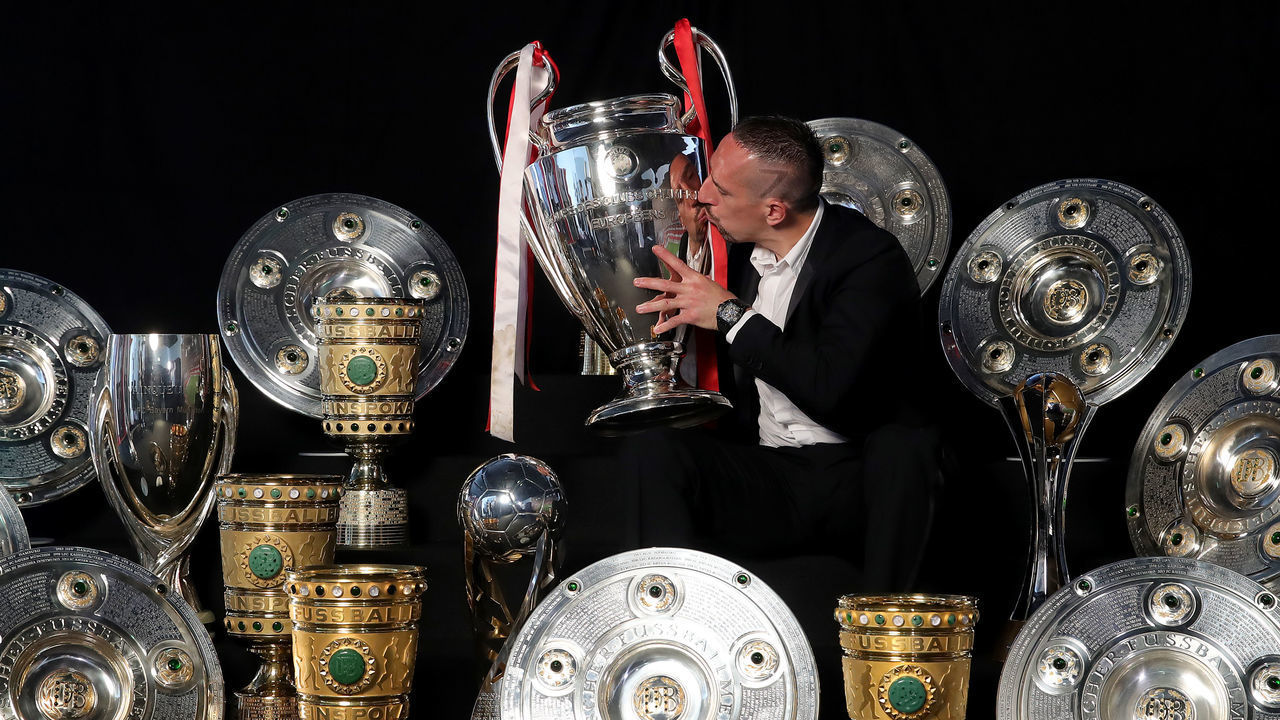 MUNICH, GERMANY - MAY 28: Franck Ribery poses for a picture with all his trophys won with the FC Bayern Muenchen team during an event at FCB Erlebniswelt on May 28, 2019 in Munich, Germany. at FCB Erlebniswelt on May 28, 2019 in Munich, Germany.