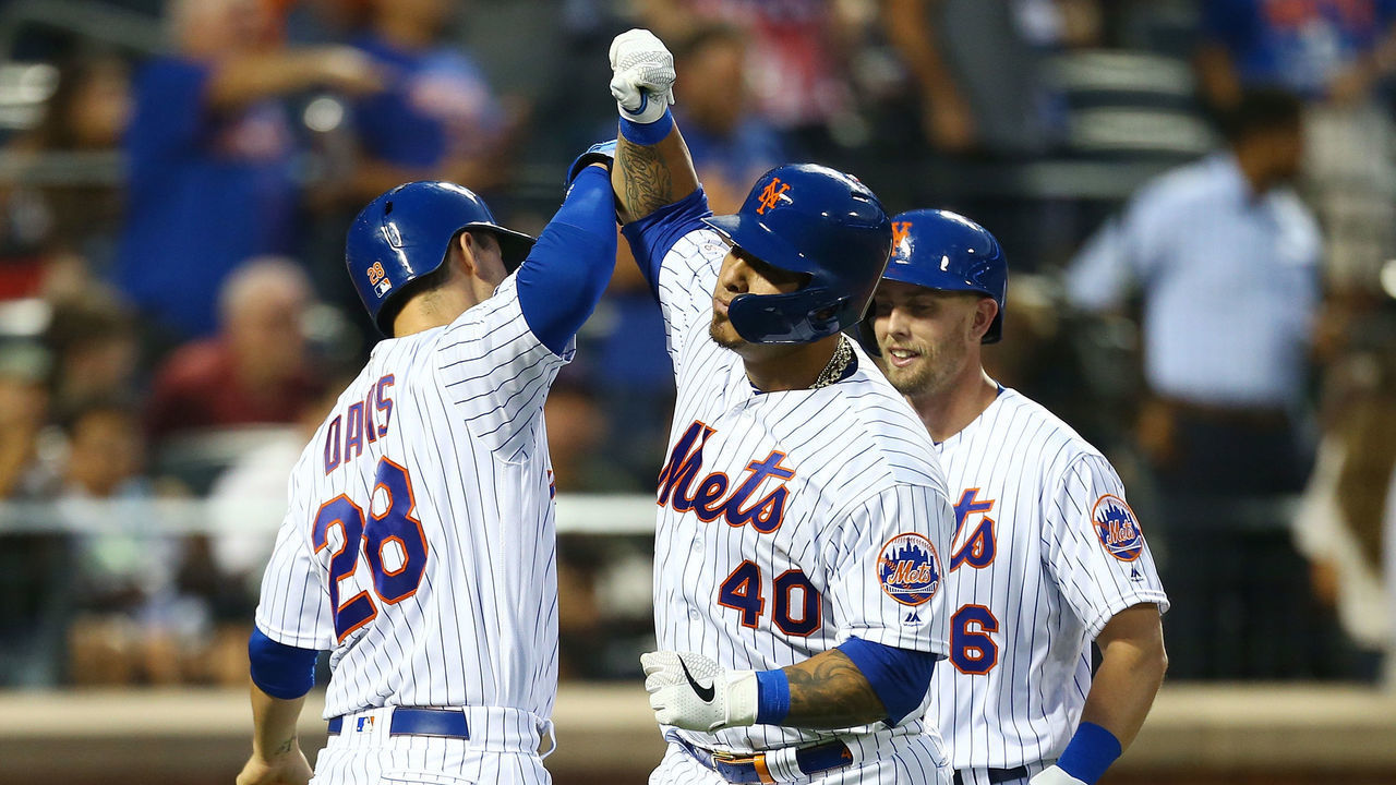 NEW YORK, NEW YORK - AUGUST 06: Wilson Ramos #40 of the New York Mets celebrates with J.D. Davis #28 after hitting a 2-run home run to center field in the third inning against the Miami Marlins at Citi Field on August 06, 2019 in New York City.