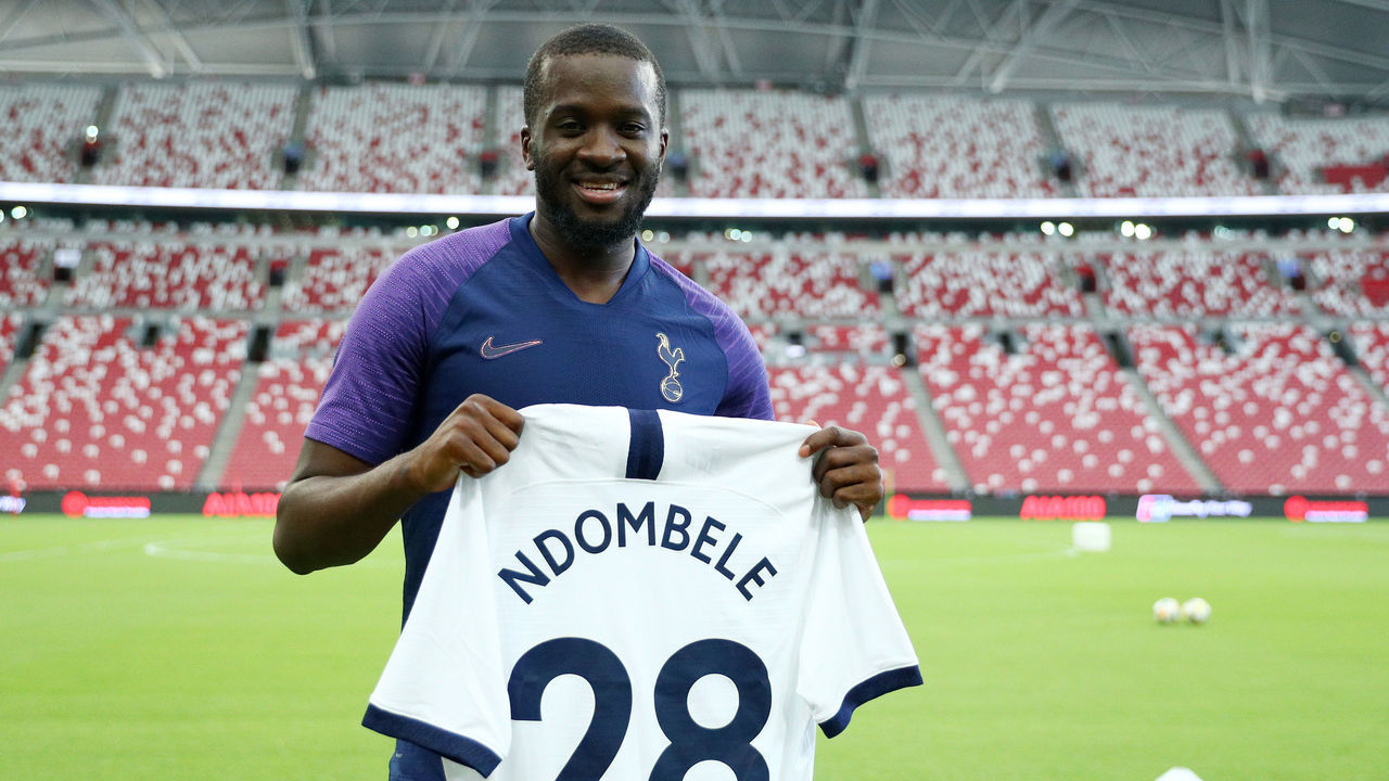 SINGAPORE, SINGAPORE - JULY 19: Tanguy Ndombele poses for a photo with his jersey during the Tottenham Hotspur official training/press conference at the Singapore National Stadium on July 19, 2019 in Singapore.