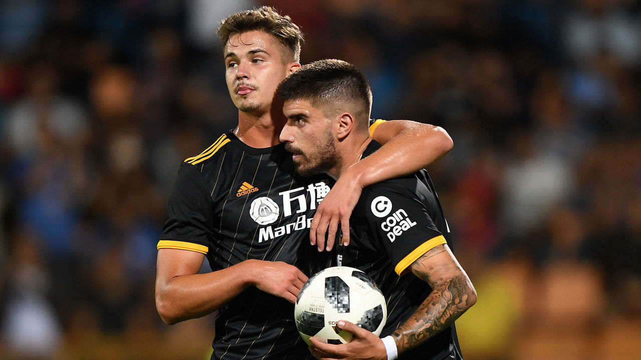 YEREVAN, ARMENIA - AUGUST 08: Ruben Neves of Wolverhampton Wanderers celebrates after scoring a goal to make it 0-4 from a penalty kick with Leander Dendoncker of Wolverhampton Wanderers during the UEFA Europa League Third Qualifying Round First Leg fixture between FC Pyunik and Wolverhampton Wanderers at Pyunik Stadium on August 8, 2019 in Yerevan, Armenia.