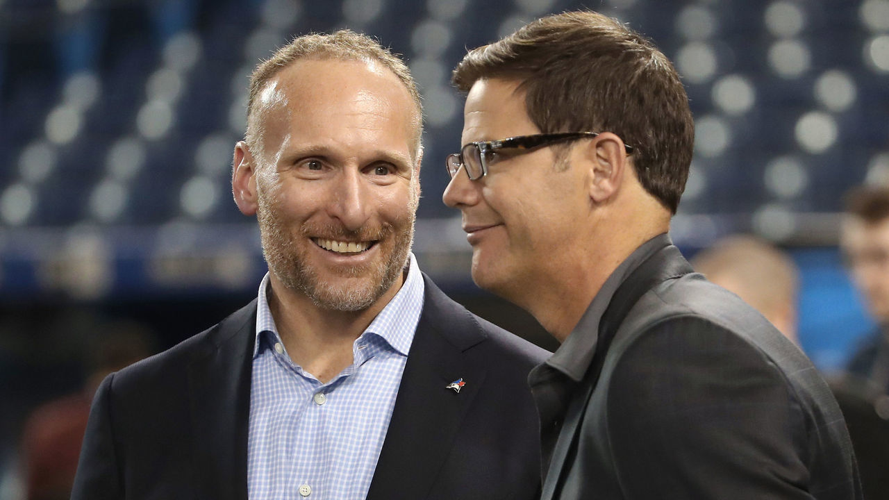 TORONTO, ON - APRIL 11: President and CEO Mark Shapiro of the Toronto Blue Jays talks to general manager Ross Atkins before the start of their home opener against the Milwaukee Brewers at Rogers Centre on April 11, 2017 in Toronto, Canada.