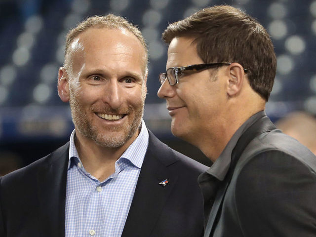 TORONTO, ON - APRIL 11: President and CEO Mark Shapiro of the Toronto Blue Jays talks to general manager Ross Atkins before the start of their home opener against the Milwaukee Brewers at Rogers Centre on April 11, 2017 in Toronto, Canada.
