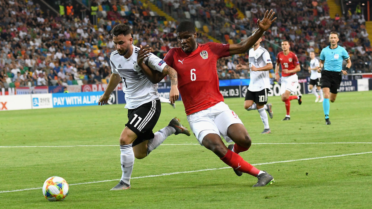 UDINE, ITALY - JUNE 23: Marco Richter of Germany competes for the ball with Kevin Danso of Austria during the 2019 UEFA U-21 Group B match between Austria and Germany at Stadio Friuli on June 23, 2019 in Udine, Italy.
