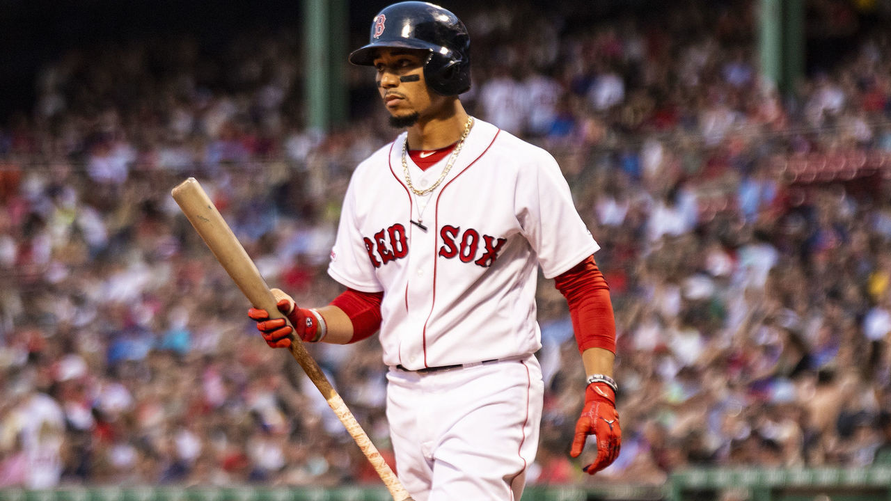 BOSTON, MA - AUGUST 07: Mookie Betts #50 of the Boston Red Sox looks on during the first inning of a game against the Kansas City Royals on August 7, 2019 at Fenway Park in Boston, Massachusetts.