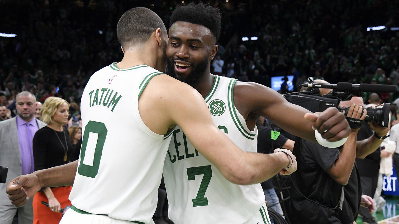 BOSTON, MA - APRIL 17: Jayson Tatum #0 hugs Jaylen Brown #7 of the Boston Celtics Game Two of Round One of the 2019 NBA Playoffs against the Boston Celtics on April 17, 2019 at the TD Garden in Boston, Massachusetts. Mandatory Copyright Notice: Copyright 2019 NBAE