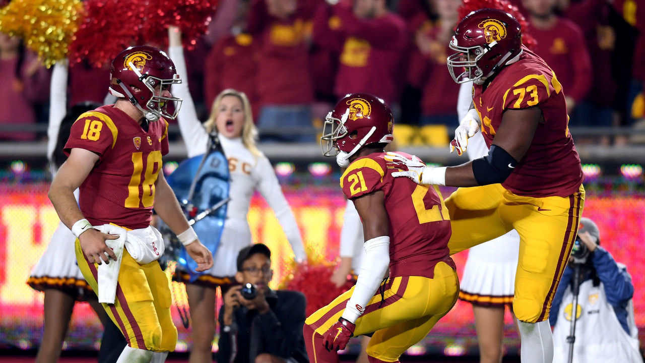 LOS ANGELES, CA - NOVEMBER 10: Tyler Vaughns #21 of the USC Trojans celebrates his touchdown catch with JT Daniels #18 and Ausstin Jackson #73 to take a 14-0 lead over the California Golden Bears during the second quarter at Los Angeles Memorial Coliseum on November 10, 2018 in Los Angeles, California.