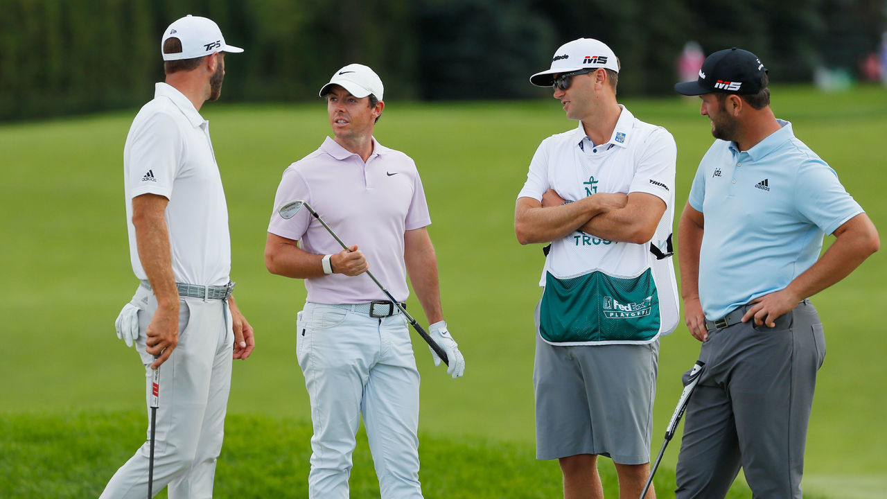JERSEY CITY, NEW JERSEY - AUGUST 09: (L-R) Dustin Johnson of the United States, Rory McIlroy of Northern Ireland, Austin Johnson, and Jon Rahm of Spain speak during a weather delay during the second round of The Northern Trust at Liberty National Golf Club on August 09, 2019 in Jersey City, New Jersey.