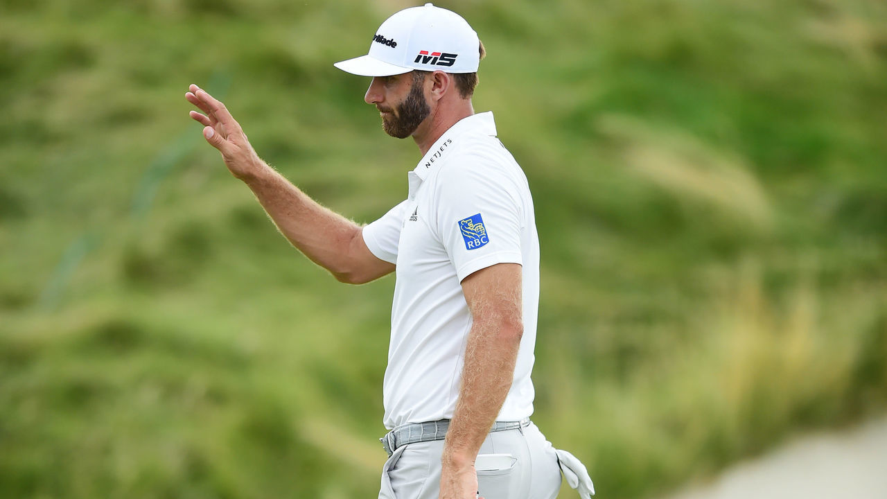 JERSEY CITY, NEW JERSEY - AUGUST 09: Dustin Johnson of the United States reacts following a putt on the 15th green during the second round of The Northern Trust at Liberty National Golf Club on August 09, 2019 in Jersey City, New Jersey.