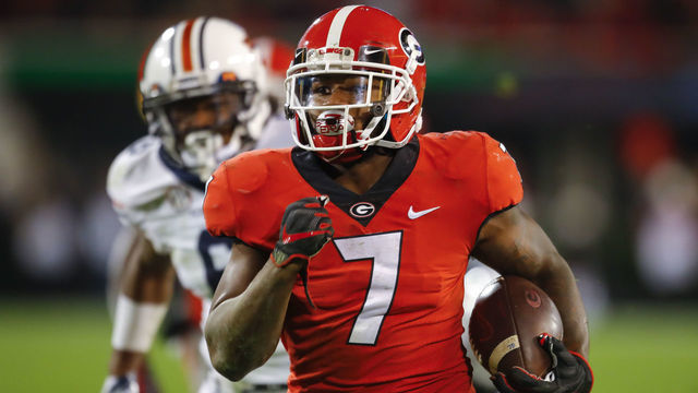 ATHENS, GA - NOVEMBER 10: Georgia Bulldogs running back D'Andre Swift (7) breaks a run for a touchdown during the Auburn Tigers v Georgia Bulldogs game on November 10, 2018 at Sanford Stadium in Athens, GA.