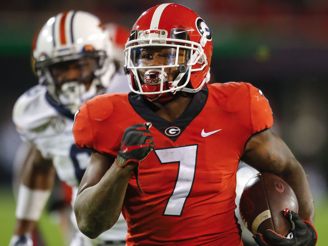 ATHENS, GA - NOVEMBER 10: Georgia Bulldogs running back D'Andre Swift (7) breaks a run for a touchdown during the Auburn Tigers v Georgia Bulldogs game on November 10, 2018 at Sanford Stadium in Athens, GA.