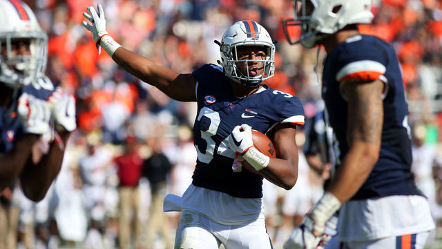 CHARLOTTESVILLE, VA - OCTOBER 21: Bryce Hall #34 of the Virginia Cavaliers celebrates a stop during a game against the Boston College Eagles at Scott Stadium on October 21, 2017 in Charlottesville, Virginia.