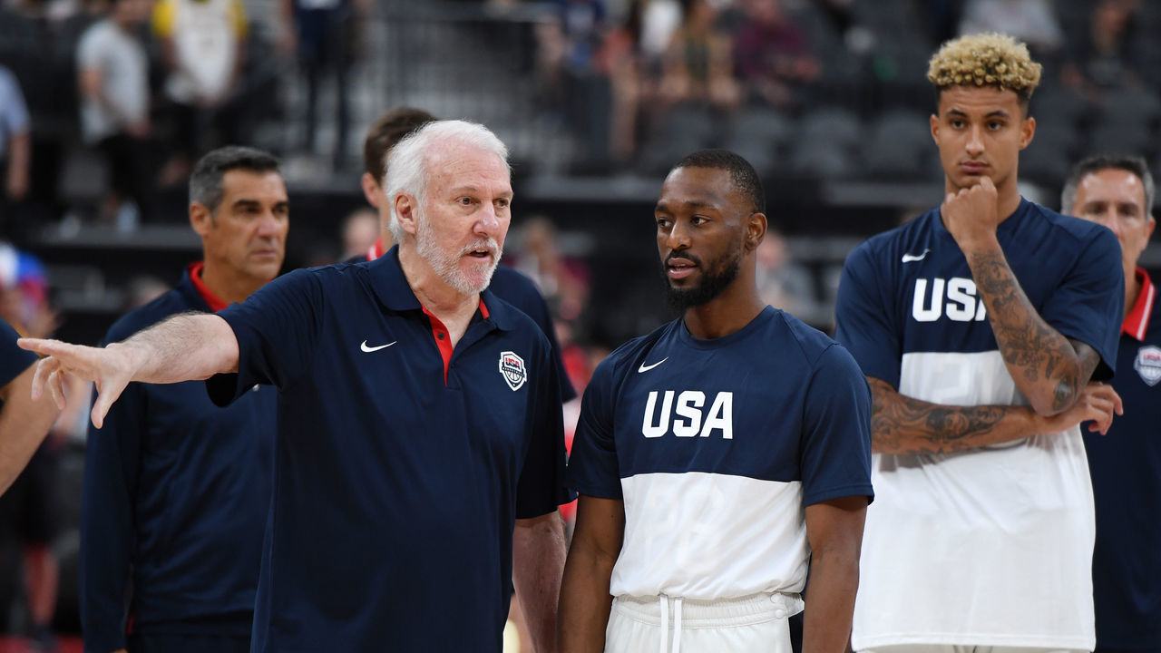 LAS VEGAS, NEVADA - AUGUST 09: (L-R) Head coach Gregg Popovich of the 2019 USA Men's National Team talks with Kemba Walker #26 of the 2019 USA Men's National Team as Kyle Kuzma #21 of the 2019 USA Men's National Team looks on before the 2019 USA Basketball Men's National Team Blue-White exhibition game at T-Mobile Arena on August 9, 2019 in Las Vegas, Nevada.