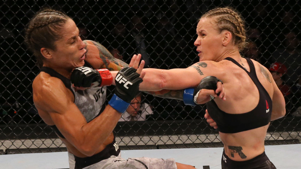 MONTEVIDEO, URUGUAY - AUGUST 10: (R-L) Valentina Shevchenko of Kyrgyzstan punches Liz Carmouche in their UFC women's flyweight championship fight during the UFC Fight Night event at Antel Arena on August 10, 2019 in Montevideo, Uruguay.