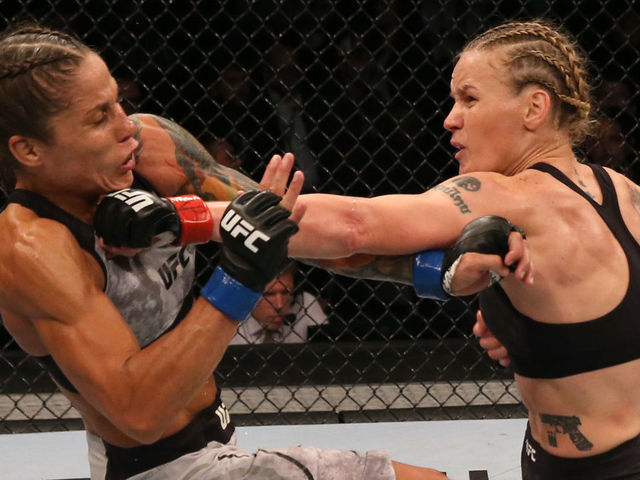 MONTEVIDEO, URUGUAY - AUGUST 10: (R-L) Valentina Shevchenko of Kyrgyzstan punches Liz Carmouche in their UFC women's flyweight championship fight during the UFC Fight Night event at Antel Arena on August 10, 2019 in Montevideo, Uruguay.